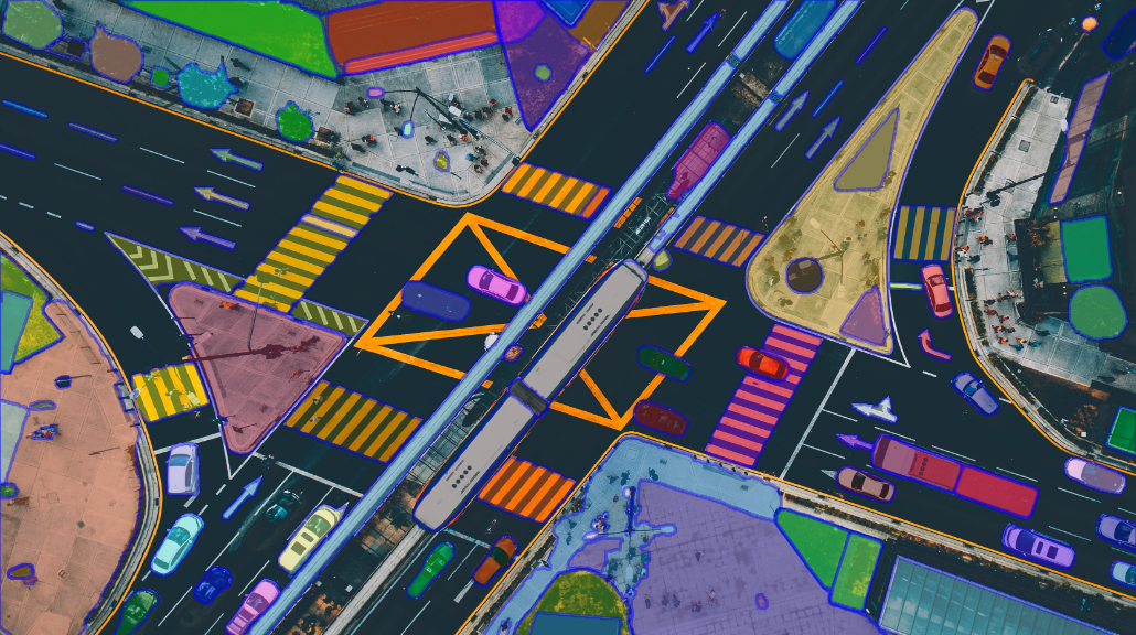 SAM applied to smart cities for traffic monitoring. This image employs instance segmentation to identify buildings, vehicles, and other objects. 
